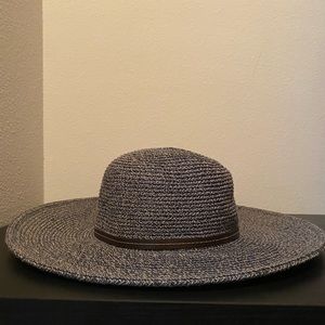 Blue woven brimmed hat with brown detail